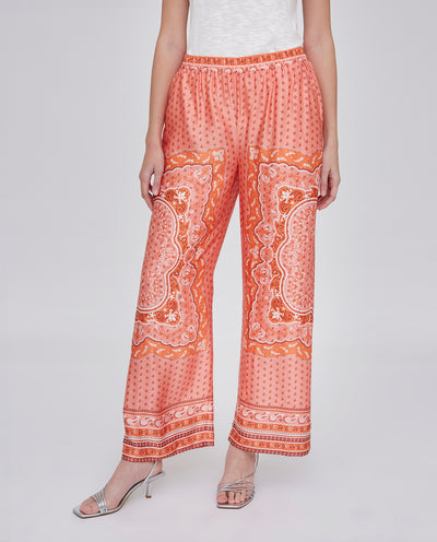 PANTALON RECTO CON ESTAMPADO POSICIONAL. NARANJA