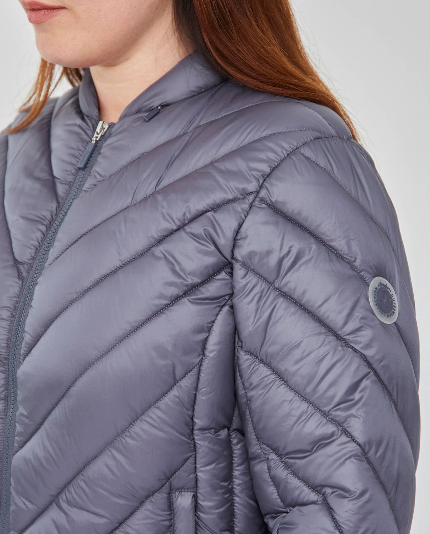 PARKA CORTA MANGA LARGA CON CAPUCHA OCULTA AZUL