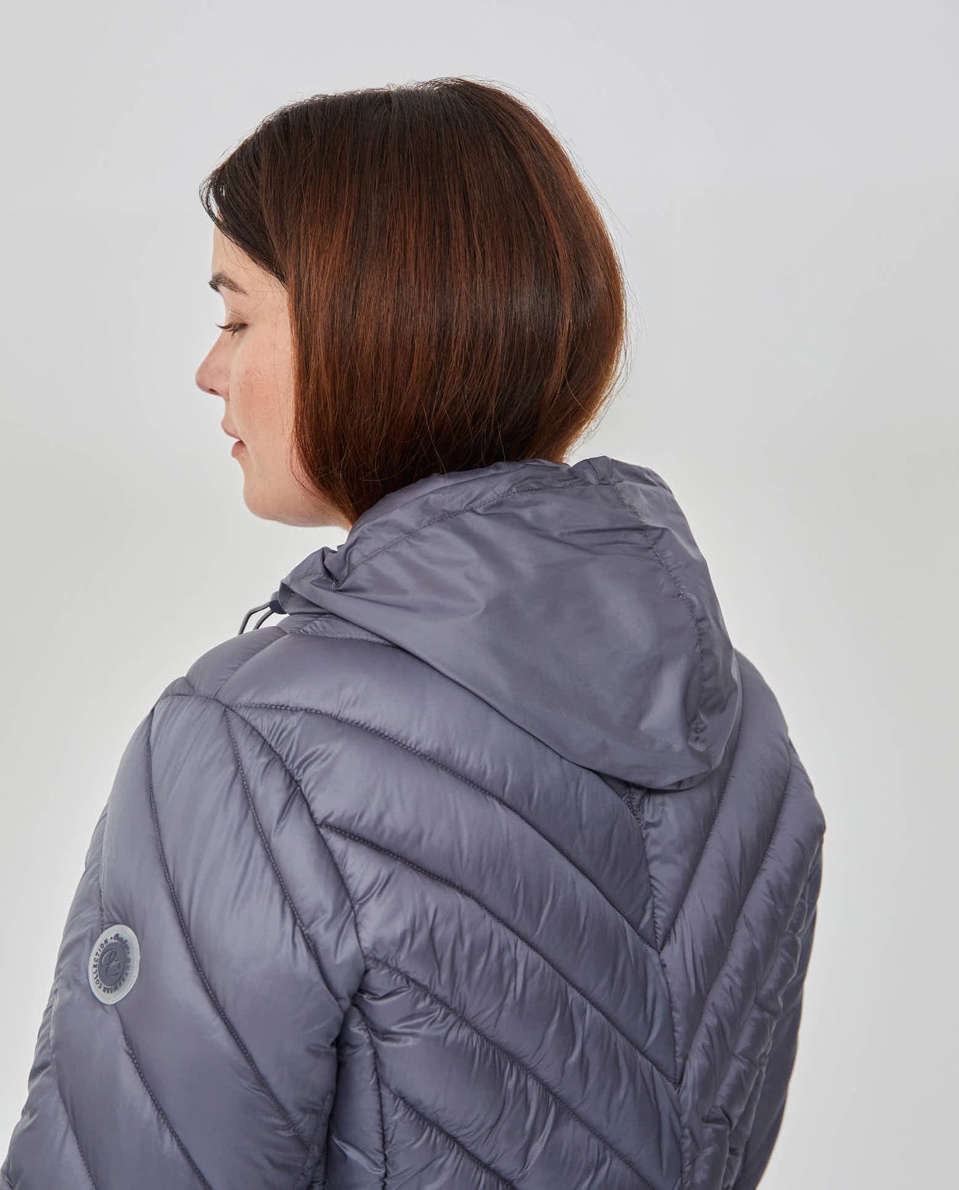 PARKA CORTA MANGA LARGA CON CAPUCHA OCULTA AZUL